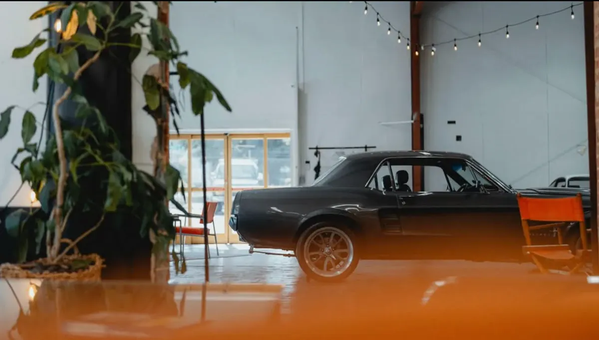 Speed House interior with a classic fastback and plants